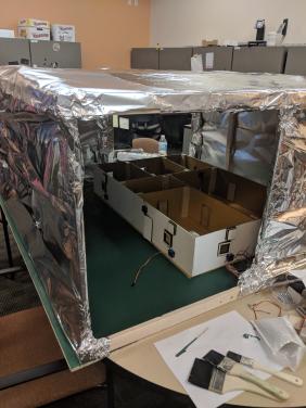The model inside the environmental enclosure