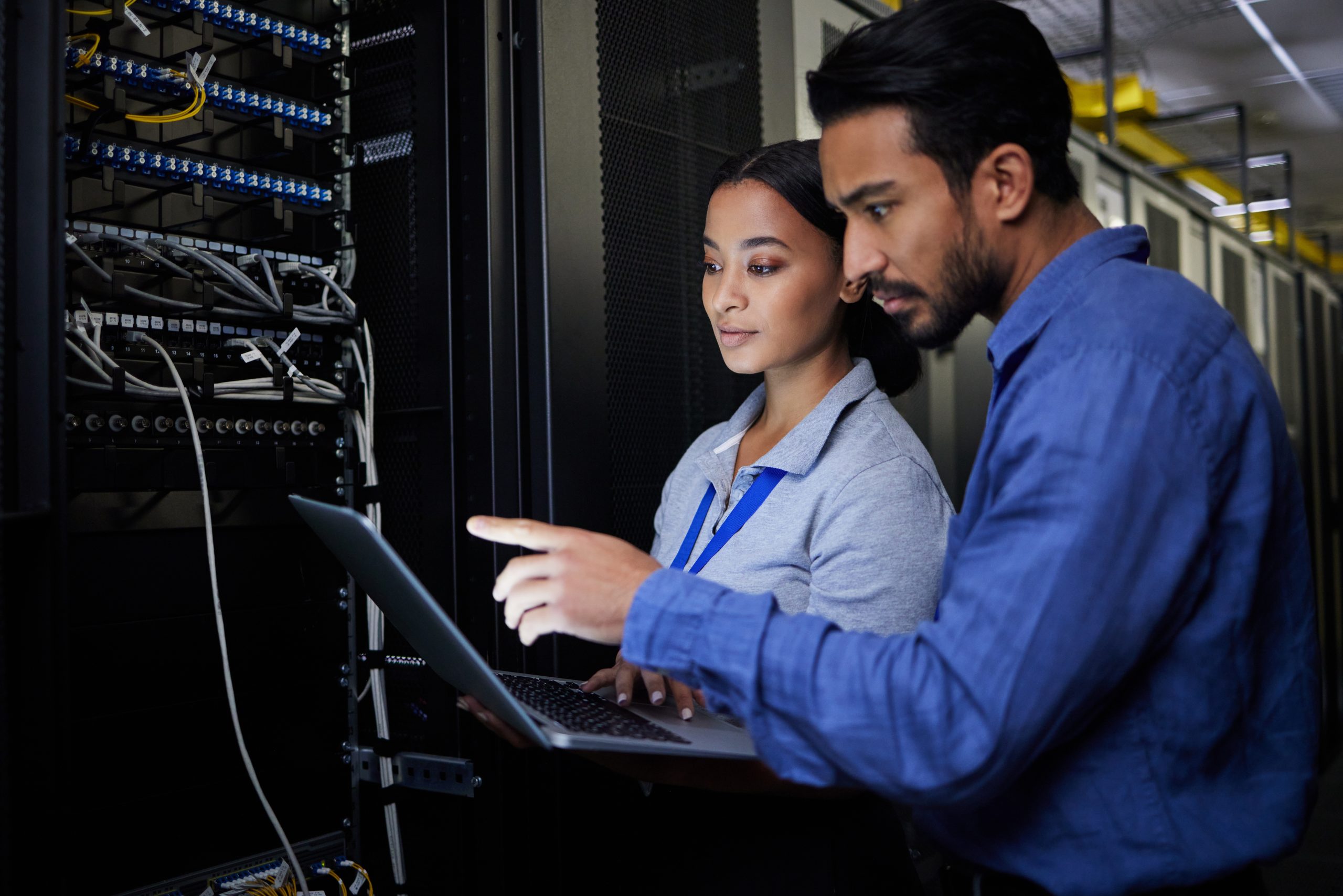 man and woman in data center