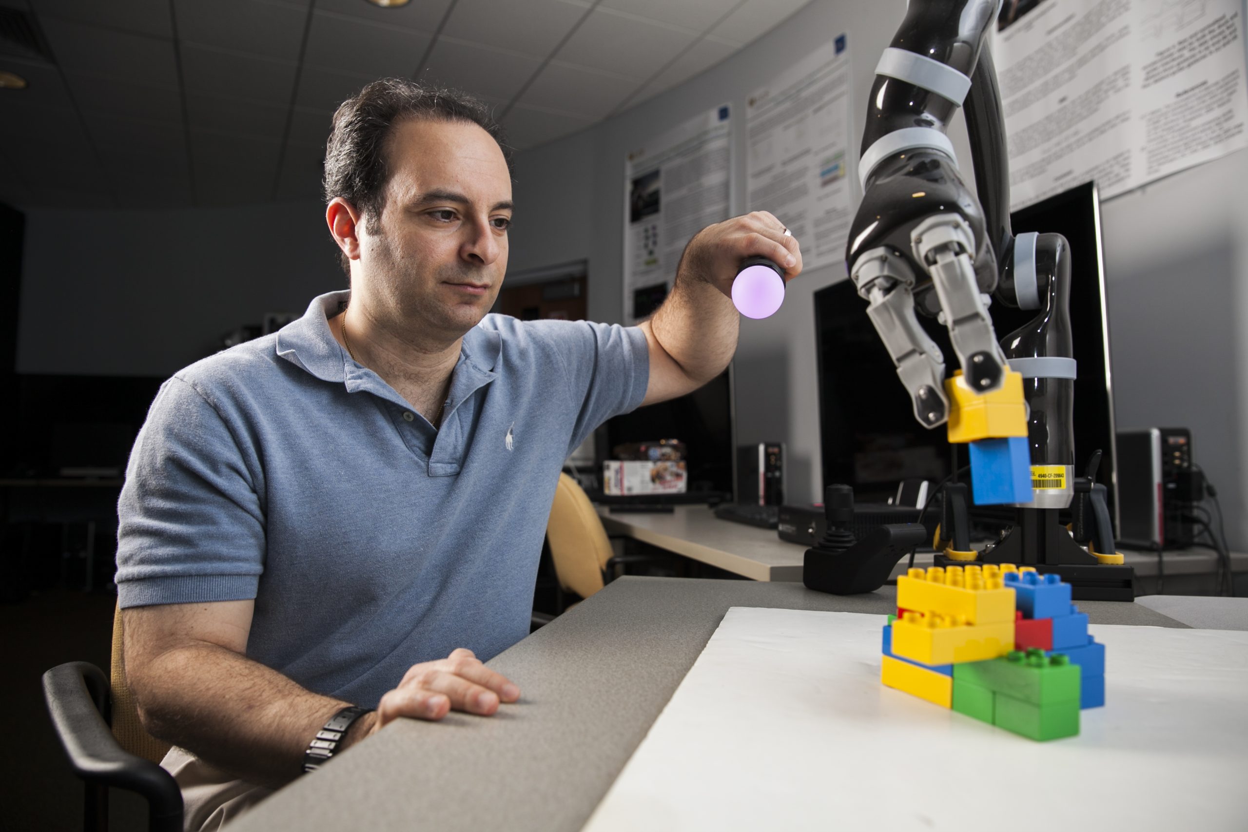 Joe Laviola with a robot