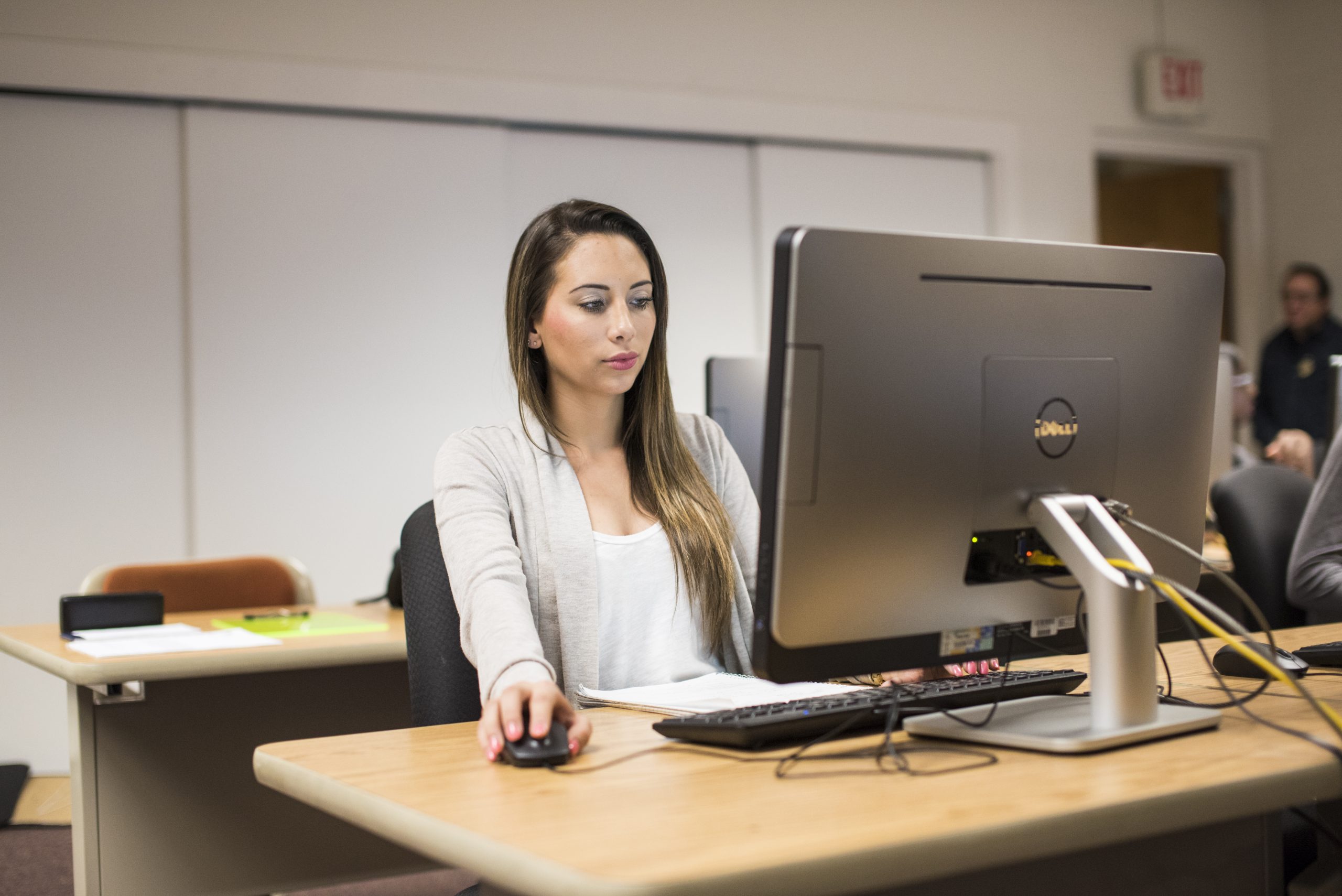 woman behind computer