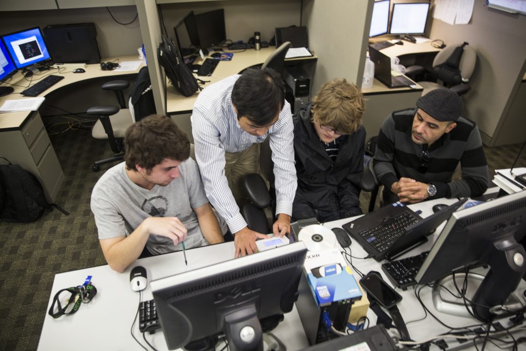 instructor with students in lab