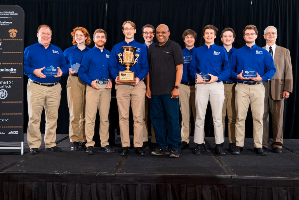 UCF alum and lecturer Thomas Nedorost ’02 (far left) and the university’s Collegiate Cybersecurity Competition Team